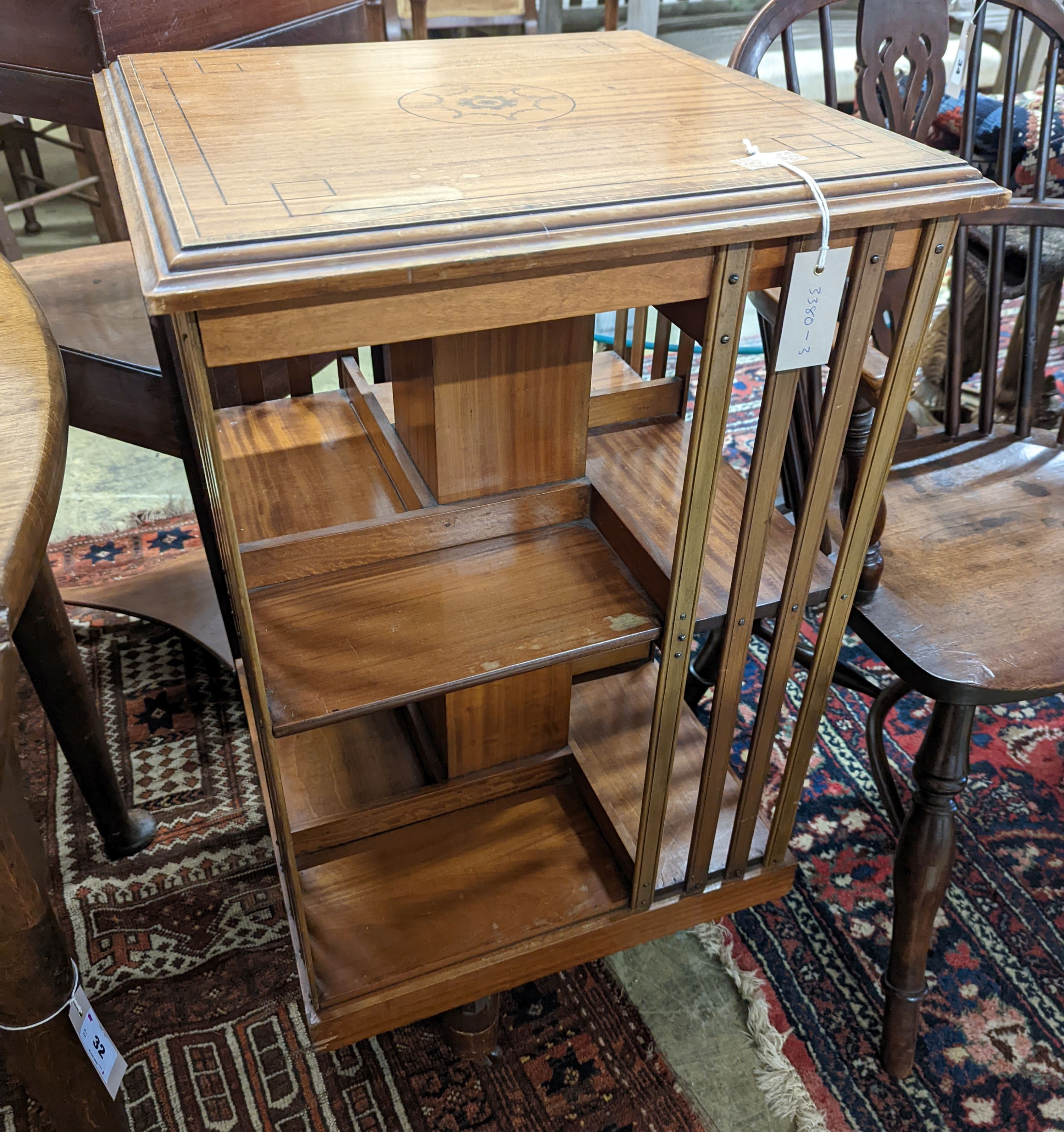 An Edwardian inlaid satinwood revolving bookcase, width 48cm, depth 47cm, height 85cm